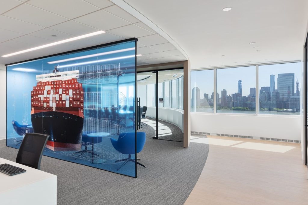 Minimal glass wall partition with colored glass.