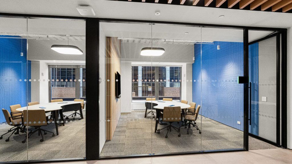 HUSH in meeting rooms with wood paneling and felt walls