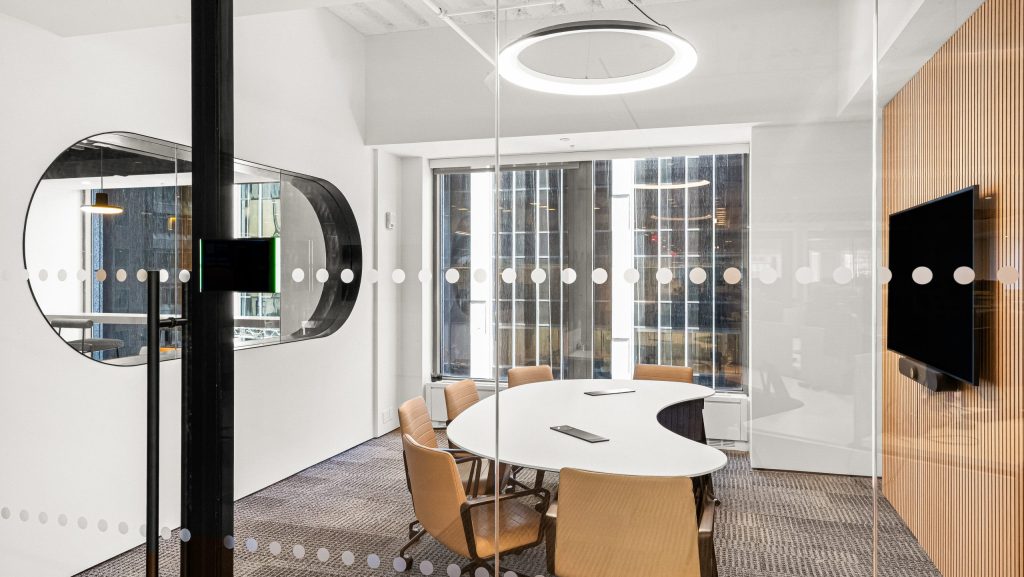 HUSH in meeting room with wood paneling